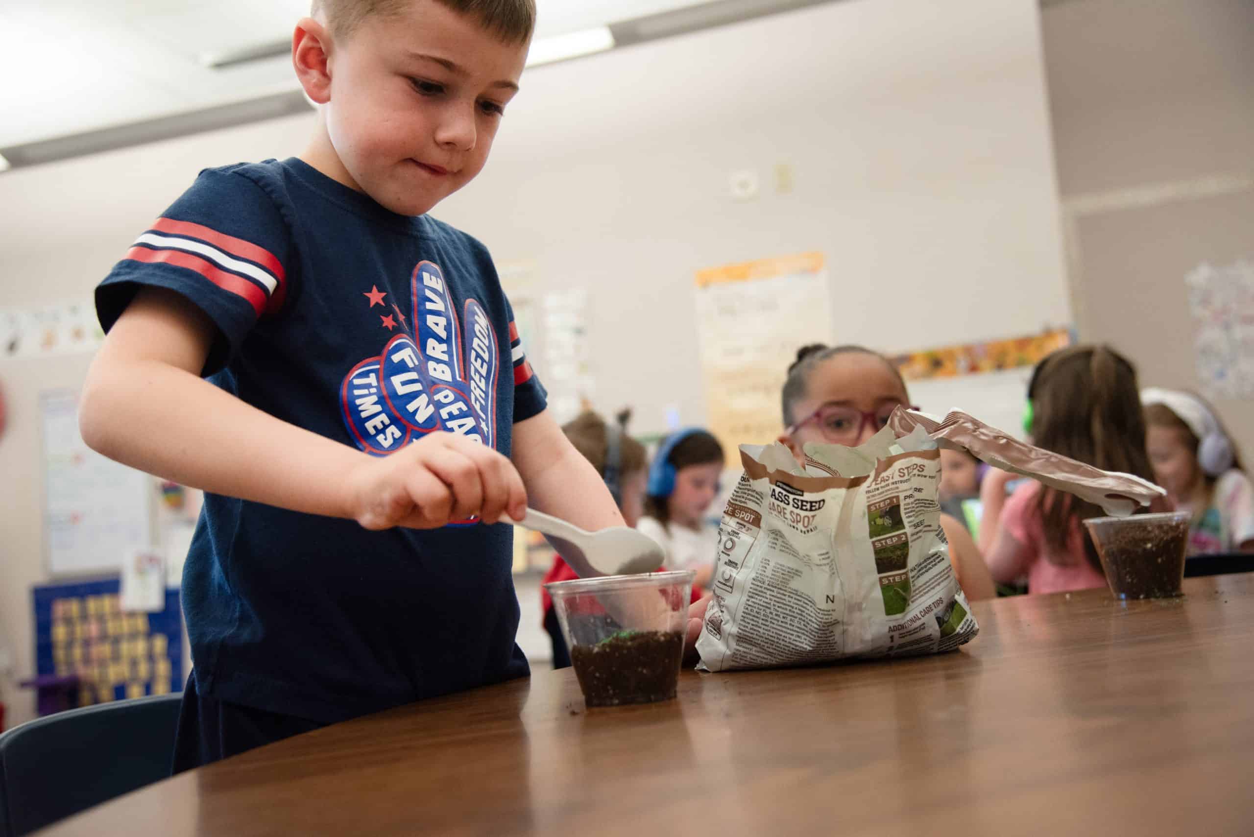 Prairie Ridge kindergarten students planting seeds